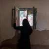 T.