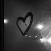 T.