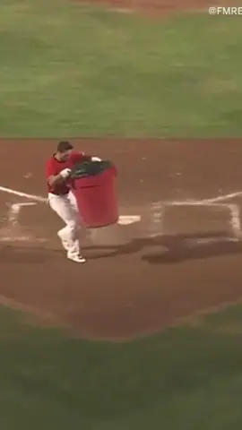He put a trash can where the umpire is supposed to be. 😂 (via @fmredhawks/Twitter)
