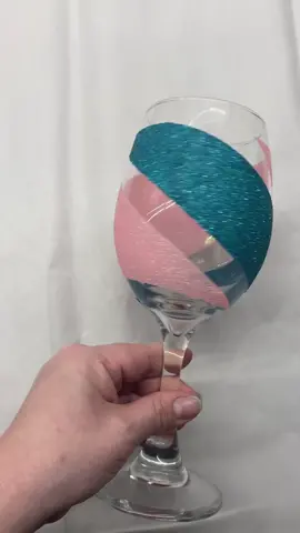 Pink and teal glitter wineglass. #glitterwineglass #glitter #sparkles #sparkly #craftymomma #artsandcrafts #craftingfun #glittercraft #justforfun