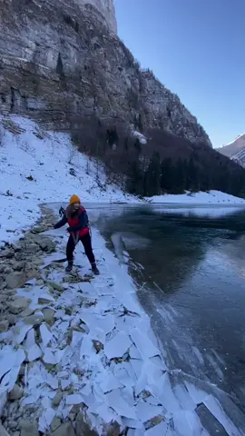 Throwing ice on a frozen lake 🥶❄️ #ice #snow #frozen #lake #frozenlake #nature #switzerland #austria #Hiking #mountains #foryou #girl #feature #fyp