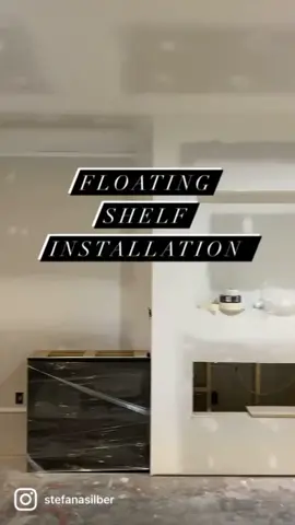 #floatingshelves from @ultra.shelf #basementremodel #fireplaceremodel #blackroom #mancave #shelfdecor #livingroomdecor #livingroommakeover #blackpaint