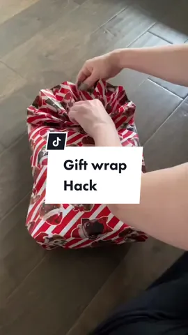 Gift wrap hack for odd shaped gifts #giftwrappinghacks #giftwrapping #christmaswrapping #christmaswrappingideas #giftwrappingideas #christmashack