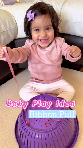 Baby play - Ribbon pull 🎀 Here’s a simple activity to keep your little one entertained.Inaaya loves using her pincer grasp to pick/pull at anything and everything!✨ This activity is great for developing fine motor skills, sensory motor skills and hand strength.#babyplay #sensoryplay  #ribbonpull #playtolearn #learningthroughplay #babytok #finemotorskils #mumblogger #funparenting #babyactivities #playwithbaby #playfulparenting