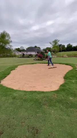 Sprucing up the sand trap.