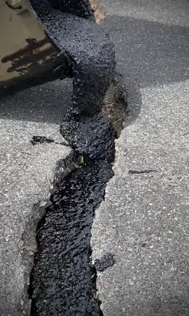 Wide crack repair. 2 lifts it’s so big! #masticone #mastic #crafco #cracksealing #asphalt #pavement #satisfying #oddlysatisfying