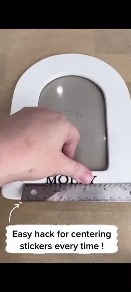 Easy hack for centering stickers perfectly every time! First stick them on the bery edge of a ruler, adjusting as needed to get them spaced how you like. Then hover the ruler over the piece until you have it centered perfectly. Press down on the stickers and slide out the ruler.  Perfect! #craftip #crafts #crafting #diycrafts #scrapbooking #cardmaking #craftsmarternotharder #tipsandtricks #papercraft #papercrafting #stickers #isthislevel? #vinylcrafts #cardmaking #cardmakersoftiktok #scrapbookingideas #rulers