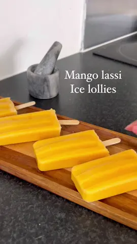 Mango anything is automatically better 🥭 #icelolly #icelollies #mangolassi#mango#easydessert #summerdessert #icecream #indianfood #desi 