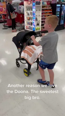 He loves showing off his new baby sis 🥰 and I get both hands free to do some damage at Target. Win win #doona #doonastroller #Siblings #momtok #newborn #babyregistrymusthaves 