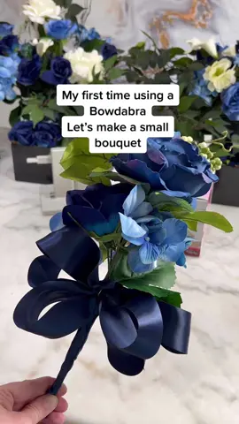 My first @bowdabra diy and I’m obsessed. I made a mini bouquet and embellished it with the perfect bow. #bowdabra #bowdabradiy #diybouquet #bluebouquet #diyfloralarrangement #weddingtiktok #diypartyideas