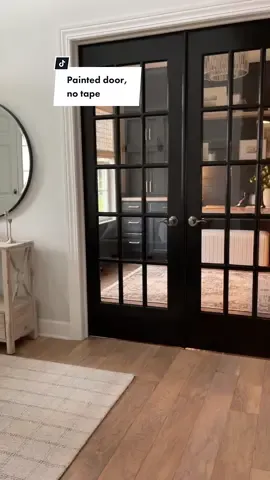 French door, painted black😍 no tape needed! Here is how:   1. Clean the glass 2. Apply Mask&Peel ( any hardware store) with a paint brush  3. Let it dry 4. Paint and let that dry  5. Score around the edges with a razor and peel extra paint right off!  Clean and crisp lines every time! No tape!  If you try it, let me know how it turns out☺️  #diyproject #painteddoors #howtopaintwindows #painingtutorial #howtopaintdoors #painttape #tricornblackpaint #SephoraConcealers #DIY #powerofpaint 