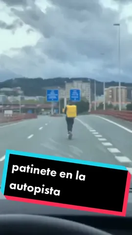 Rider de Glovo circulando con patinete eléctrico en la autopista A8 a la altura de Barakaldo.