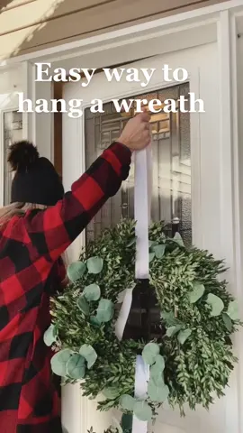 I use this every season, and it hasn’t failed me yet. I have a metal door, but the frame is wood. After the thumbtacks are in, I trim the ribbon so that it’s not trailing down the other side of the door. Thank you @Martha Stewart for this hack! #christmasdecorating #wreath #christmaswreath #christmasdecor #easychristmasdecor 