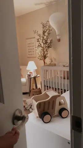 Instead of decorating our nursery in a specific theme or color I wanted to create more of a mood. The atmosphere needed to feel warm and cozy so I set the tone by choosing natural wood furniture and soft decor items that will grow with my baby as he gets older.  Check out my Linktree for all the links  #neutralnursery #nursery #nurserydecor #nurserytour #genderneutral #modernnursery #nurseryinspo #crib #babyletto #targethome #glider #kidsroom #kidsroommakeover #kidsroomideas #nurseryreveal #babyroom #earthyhome #neutraltones #woodtoys #hotairballoon 