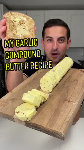 ✔️ GRUB RECIPE: THE BEST DAMN GARLIC BUTTER 💯 This compound butter is hitting you just in time for the holiday season. You’ll use it in everything. The best part? It’s incredibly easy to make & will have you looking like a pro at your next dinner party. ✌️ This is perfect for pasta, bread, eggs - just about anything that gets the butter treatment. Full recipe below!  👉 You can mold these into any shape but I’ve always found rolling it makes it easy to store and cut right into. 🔪  📌 COMPOUND GARLIC BUTTER RECIPE  1️⃣ In an oven safe small pan, lay flat 20 peeled garlic cloves and covered with extra virgin olive oil and two sprigs rosemary. Place in an oven at 350 degrees until cloves have turned golden brown and are soft. Sit aside and let cool.  2️⃣ Let three blocks of Kerry Gold butter sit until they are room temperature and soft throughout. Put them in a large mixing bowl. Add in the roasted garlic cloves, 8 leaves of chopped sage, handful of chopped Italian parsley, 4 rosemary sprigs (off the stem) and a tablespoon of crushed red pepper. Mix with electric hand mixer until well blended.  3️⃣ Once mixed add in a tablespoon of the chilled oil used to cook the garlic. Mix with electric hand mixer until blended but still firm.  4️⃣ Roll out parchment paper. Place long line of whipped butter and roll tightly to create a cylinder. Twist at the ends.  5️⃣ Put in the refrigerator until hard.  6️⃣ Take out and slice as needed for recipes!  🫡 The best dang garlic butter around! And YOU made it. Now that’s a win, Grubfam! #thegrubfather #Recipe #garlic #butter #thanksgiving #Foodie 