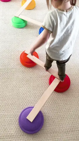 Here’s an easy way to burn energy this winter! My daughter paired our @stapelstein step stones with Everwood Friends unit blocks to create different balance beam options.  Not only is this a great gross motor activity, but configuring the balance beam is a great STEM activity, too! #stem #grossmotorskills #momhack #kidsactivities #playideas 