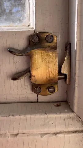 We found this gorgeous, brass hardware, hiding under 130 years of paint! #oldhouse #mysteries #sashwindows 