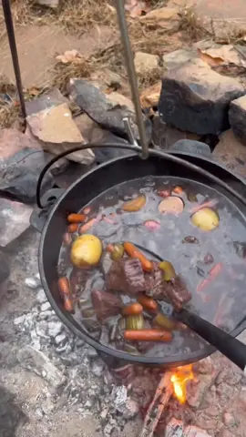 Campfire beef stew! I love making stews, soups, or chilis on cabin trips. What’s your go-to campfire meal? #campfire #campfirecooking #dutchoven #outdoorcooking #ourdoorkitchen #stew #beefstew #Foodie #foodporn #castiron #castironcooking #ouachita #openfirecooking #Recipe #recipes #recipetok #foodtiktok #FoodTok 