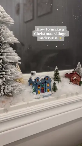 Christmas village under $10. Everything is from @dollaramacanada - bristle brush trees, artificial snow, and little village buildings. Perfect for a window sill, desk, cabinet, or shelf.  #christmasdiy #christmasdiydecor #christmasdecorhack #christmasvillage #xmasfyp #christmastiktok 