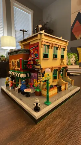 Sesame Street Corner Modular | Part 1 The modular consists of roughly 1,890 pieces and is actually an alternative build to the LEGO Ideas 123 Sesame Street Set 21324.  This build features the 123 Townhouse and Hoopers Shop like the original Idea set with a fun little surprise in the back. All you will need to build this modular for your city is two of the original sets plus roughly an additional 120 pieces (mainly consisting the sidewalk tiles and base plate).  Instructions are available for purchase from the designer Lawis on Rebrickable: https://rebrickable.com/mocs/MOC-84415/lawis/sesame-street-corner/#details ^The link to the designers instructions on Rebrickable can also be found in my link tree which is located in my bio. #lego #afol #legolife #legoaddict #legobricks #legogram #instalego #legocollection #legostagram #legos #legomania #brickcentral #legofan #bricknetwork #legocity #legoart #legolife #lego_hub #legomoc #legocreator #legography #legoideas #legobricks #legofun #rebrickable #sesamestreet #legomodular #minifig #fyp  #legominifigure #minifigure