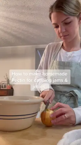 Making pectin at home is so easy! You can can it and save it for making homemade jams and jellies in the summer instead of buying packaged pectin from the store.🍎🫶🏼 • • 7 large apples 4 cups of water 2 Tbsp lemon juice • • Start by washing your apples. You do not need to peel them, but you should cut them into pieces before placing them in a large pot. Put this stockpot on your stove. Add four cups of water and two tablespoons of lemon juice. Lastly, add your apple pieces. Boil the mixture for 40 minutes. You will notice that the apples become very soft. Make sure you stir the brew often to prevent it from scorching or burning and sticking to the bottom of your pot.  Strain the mixture through a piece of cheesecloth. Let it sit for at least four hours (or even as long as overnight) to remove as much juice as possible from the mixture.  Return the pot with the liquid to the stovetop. Boil for another 20 minutes before pouring it into sterilized jars. It will have reduced by about 50% by this point. You can now can, freeze, or refrigerate your pectin, using it up as needed. To can it, you can process 1/2 pints for 10 mins in a water bath canner. #homemaker #canning #waterbathcanning #homesteading #jamsandjelly #homemade 