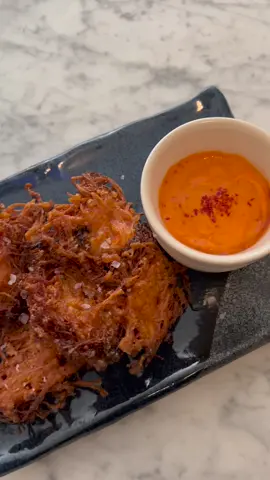 ENOKI MUSHROOM FRITTERS w/ honey gochujang aioli recipe: for the fritters, 1 pack enoki mushrooms  3 tbsp cornstarch  1 tsp gochugaru 1 tsp white pepper 1 tsp ground ginger pinch kosher salt 1/4 cup water  oil for frying for the aioli, 3 tbsp kewpie mayo 1 tbsp gochujang 1 tsp honey 1 tsp gochugaru  1 clove grated garlic mix cornstarch, seasonings and water together. don’t worry if the batter seems super watery, it’s only really there to flavor/bind the mushrooms, it’s not meant to be super thick or cakey.  heat enough oil to coat the bottom of the pan over medium-high (I went a little too hot and smoked up my whole kitchen and also had to spend an hour cleaning burnt oil off of my favorite pan 🙃 but that’s half the fun of deep frying amirite) lay down the fritters carefully and fry for about a minute on each side, drain on a paper towel, and salt them while they’re still hot! these are super fun, almost no effort, and would be great for a dinner party or potluck!  #fyp #mushroom #mushrooms #enokimushroom #enoki #fritter #fritters #crispy #korean #koreanfood #gochujang #EasyRecipe #EasyRecipes #asmr #asmrvideos #asmreating #asmr_tingles #relaxingvideos #relaxingvideo #cooking #cookingvideo #dinnerwithme #dinnerparty #potluck #potluckdinner #cookingvideos 