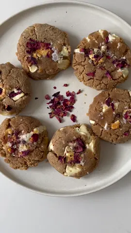 Valentine’s Day white chocolate rosewater cookies  ingredients: 1 stick butter, browned  1 large egg 3/4 cup dark brown sugar 1/4 cup granulated sugar 1 tsp good vanilla extract 2 tsp rosewater 1 1/2 cups AP flour 1/4 tsp baking powder 1/2 tsp kosher salt 1 bar white chocolate, chopped  Rose petals Flaky salt recipe: brown your stick of butter over medium heat until the solids turn a golden brown. add ice to replace the lost moisture and cool the butter/ stop it from browning further. let it come to room temp while measuring out the rest of your ingredients  combine sugars, butter, egg, vanilla and rosewater and add to the sifted flour mixture. fold in your chopped chocolate, being careful not to overmix! refrigerate the dough for a minimum of 1 hour, preferably overnight and up to 3 days for the best flavor development.  bake at 325F for 20-22 minutes, let cool completely, garnish and enjoy! #ValentinesDay #fyp #cookies #cookie #baking #bakingrecipe #bakingszn #cookiedough #whitechocolate #valentines #valentine #EasyRecipe #EasyRecipes #food #Foodie #foodies #FoodieTokPH #sweets #dessert #desserts #foodietiktok #foodblogger #foodiesoftiktok #cookingathometiktoktv #cooking #bakingvideo #cookingvideo #cookingvideos 
