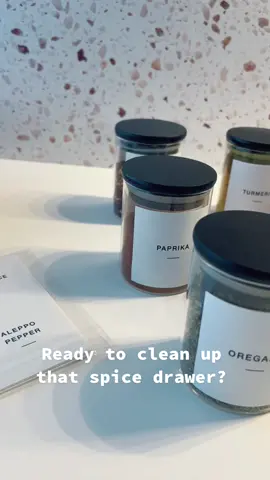 Black bamboo lids sit atop these glass spice jars. We love this option for organizing your spice drawer.  #spicejar #homewares #blackandwhite #spices #spiceitup #homegoods #homeorganization 