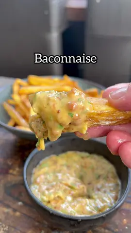 All about the Sauce, 39 of 50. Baconnaise, quite literally not for the faint hearted! Certainly not an everyday sauce but a real treat on a burger or with some chips/fries. It’s so filthy but it’s so good..  150g smoked bacon 2 egg yolks 1 tbsp whole grain mustard Squeeze of lemon juice 1 tbsp Sherry or white wine vinegar 2 garlic cloves 1 tbsp maple syrup or honey Handful of flat parsley  Salt to taste  Neutral flavoured oil if needed 1. Add the bacon to a cold pan then turn on the heat to medium, render out as much fat as you can you may need to add some oil to this as for 2 egg yolks you’ll need around 200ml of fat 2. Strain off the fat and add the bacon bits to an oven at 160c/320f for 10-15 mins to crisp up 3. Whisk the egg yolks with the mustard, lemon, and vinegar before streaming in the slightly cooled fat constantly whisking to form the mayonnaise.  4. Add the garlic and maple before chopping up the crispy bacon and parsley stirring that all through. 5. Taste for seasoning of salt and lemon 6. Go for a run or a bike ride to balance out the calories #sauce #sauces #cooking #Recipe #bacon 