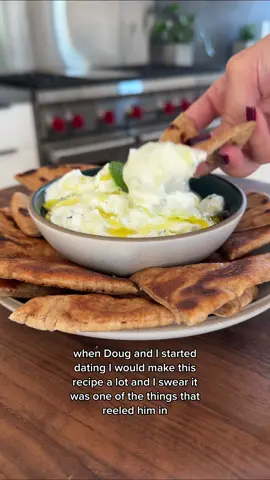 Doug's favorite tzatziki 🥰 . ▪️1/2 Large Cucumber, grated▪️2 Cups 2% or Full Fat Greek Yogurt▪️1 Clove Garlic, grated or minced▪️2 Tbsp Fresh Mint, finely chopped▪️Juice of 1-2 Lemons▪️1 Tbsp Olive Oil▪️1/2 tsp Salt▪️Pita▪️ . 1️⃣ Mix all ingredients besides pita (start with one lemon); taste and add more lemon or salt if needed!  2️⃣ Grill pita in a pan over medium high with olive oil for ~2 mins per side until golden brown and warmed through . 🕐 10 minute total prep + cook time . #tiktokfood #couplestiktok #healthyrecipes #cookingtiktok #tzatziki 