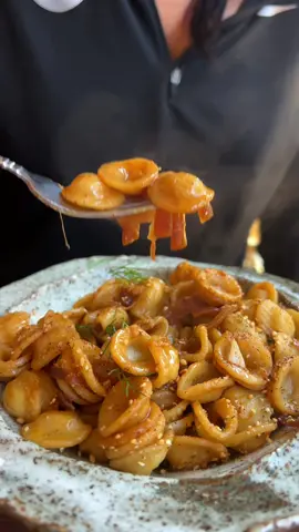 #Healthy #Creamy #Pasta | I was inspired by @plantbasedrd to make this pasta and it turned out so good! Using hummus as my substitute for cream, sour cream, and mayo is one of my favorite cooking hacks!! Enjoy! #foodtiktok #FoodTok #veganrecipesforbeginners   . 12 ounces orecchiette 1 tbsp EVOO 1 onion, julienned (I used both red and white) 3 cloves garlic, minced Creole seasoning salt, pepper 2 tbsp soy sauce 1 to 2 ladles pasta water 2 tbsp hummus garnish with fresh herbs and toasted sesame seeds
