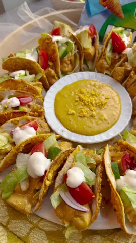 WRAPPED BUGLES TACOS WITH SPICY CHICKEN #bugles #tacos #Ramadan #Ramadan2023 #Recipe #inspiration #iftar #fy #fyp #foryou #foryoupage #trending #viral WRAPS 4 wraps (16 rounds) 100 g Bugles (nacho cheese) 75 g onion sauce (or samurai sauce) CHICKEN MIXTURE 10 ml sunflower oil 350 g chicken fillet 5 g chicken seasoning (1⅔ tsp) 3 g paprika powder (1 tsp) 4 g onion powder (1⅓ tsp) 4 g garlic powder (1⅓ tsp) 2 g cayenne pepper (⅔ tsp) 50 g onion sauce 50 g mayonnaise TOPPING Iceberg lettuce Cherry tomatoes Red onion Cucumber INSTRUCTIONS Grind the Bugles in a food processor until fine. Take a wrap, fold it in half and then fold it again to make a quarter-folded wrap. Cut rounds out of it. Repeat this process (you can use the leftovers to make tortilla chips).   Take a wrap and spread some onion sauce on it. Press the wrap into the finely ground Bugles. Repeat this process.   Place the tacos next to each other in a muffin tin. Place the Bugles tacos in a preheated oven at 200 °C. Bake for 5-7 minutes. Keep an eye on the oven, as each oven works differently. Let the tacos cool in the muffin tin so they keep their shape.   Remove the Bugles tacos from the muffin tin and set them aside.   Wash and cut the chicken fillet into small pieces. Heat the sunflower oil in a frying pan over medium heat. Add the chicken, chicken seasoning, paprika powder, onion powder, garlic powder and cayenne pepper. Fry for 6-7 minutes.   Put the onion sauce and mayonnaise in a deep bowl. Mix everything together. Add the chicken and mix everything together.   Cut the iceberg lettuce, cherry tomatoes, red onion and cucumber into small pieces.   Take a Bugles taco and fill it with iceberg lettuce, chicken and top it off with the fresh vegetables.   Place the Bugles tacos on a plate and enjoy your meal!  