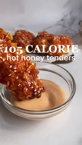 103 CALORIE HOT HONEY CHICKEN TENDERS 😋 This recipe makes 4 regular sized tenders.  Macros per tender:  103 calories  11.25g carbs  10.5g protein  1.25g fat Macros for all the tenders: 413 calories  45g carbs  42g protein  5g fat  Ingredients:  * 150 g chicken breast cut into strips * 30 g cornflakes crushed Marinade: * 100 g fat-free yogurt * 1 tbsp lemon juice * ½ tsp vegetable stock powder * ½ tsp paprika * ½ tsp all-purpose seasoning * ½ tsp garlic granules Hot honey glaze: * 2 tsp honey * 2 tbsp sriracha Spicy mayo (optional):  * 2 tbsp lighter than light mayo * 2 tsp sriracha Instructions:  1. Pre-heat oven to 200°C (392°F).  2. Make the marinade by mixing together the yogurt, lemon juice and seasonings until well combined. Set aside.  3. Crush the cornflakes into a small bowl and set aside.  4. If you're using whole chicken breast, measure out 150g and cut into strips. I was able to cut 4 regular sized tenders out of it. Place the chicken strips into the marinade and coat well. You can leave the chicken in the marinade for 30 minutes if you'd like it to be more tender and juicy.	 5. Remove the chicken from the marinade and coat in the crushed cornflakes. Place the tenders onto a baking tray lined with parchment paper and bake for 15-20 minutes.  6. In the meantime, make the glaze by mixing together the honey and sriracha until well combined. Once the chicken is out of the oven, coat in the glaze and enjoy!  #weightloss #lowcalorie #caloriedeficit #chicken #tenders #hothoneychicken #dinner #DinnerIdeas #Ramadan 