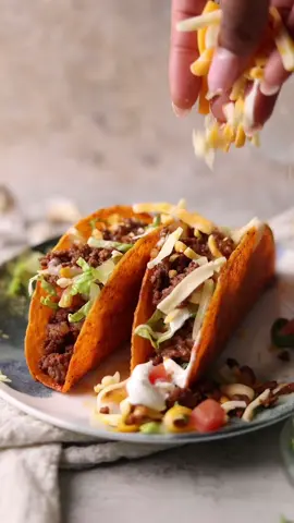 Ya’ll like taco’s or nah?  Happy Taco 🌮 Tuesday, ya’ll 😋  Elevate your tacos with these amazing nacho cheese taco shells by @oldelpaso 💥🔥🔥 So cheesy & flavorful! My ground meat recipe is basic but amazing!  1 lb 80/20 lean ground beef or ground turkey  1/2 a small red onion, diced  1/2 a small white onion, diced  1 tbsp garlic, minced  1 packet of taco seasoning or use homemade  1 tsp cumin  Kosher salt and pepper to taste  2/3 cup water  1 tbsp tomato paste  Top with cheese of choice, lettuce, tomato & sour cream 😋  How many tacos are you having? 👀