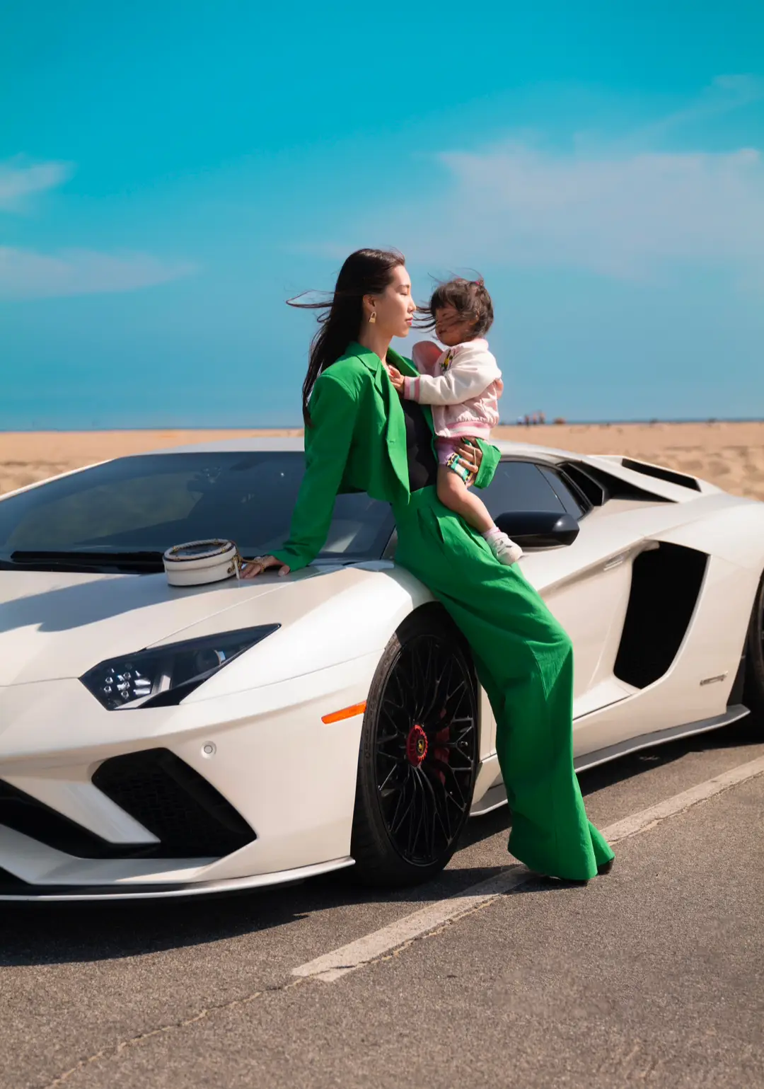 Crusing down the coast in style with my little one. I haven’t been wearing matching suit and pants for a while. This green set turned out it be cool yet playful for this shoot.  #lamborghini #fashioneditorial #beachday #mommyandme 