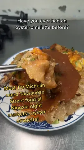 MICHELIN OYSTER OMELETTE TAIPEI Oyster omelette is a Taiwanese street food staple that is an absolute must try if you’re visiting Taiwan for the first time Yuan Huan Pien Oyster Egg Omelette aka 圓環邊蚵仔煎 (Yuán huán biān hézaǐ jiān) has been serving them up since 1965 and you can get a plate of this goodness for just $4! But did you know Ningxia Night Market is home to 𝐅𝐈𝐕𝐄 Michelin Bib Gourmand rated eats? Check out exactly which five over on my youtube where I also give you the dish names in Chinese, English and Chinese phonetics so that you can order despite any language barriers! 𝐲𝐨𝐮𝐭𝐮𝐛𝐞.𝐜𝐨𝐦/@𝐩𝐡𝐚𝐭𝐥𝐢𝐟𝐞𝐩𝐫𝐨𝐣𝐞𝐜𝐭 Yuan Huan Pien Oyster Egg Omelette , No. 46號, Ningxia Rd, Datong District, Taipei  𝙁𝙤𝙡𝙡𝙤𝙬 me for more food and travel content! #ningxianightmarket #taiwanesestreetfood #oysteromelette  #taipei  