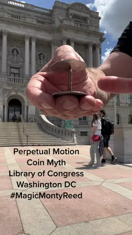In front of the Library of Congress, Washington DC. The “Perpetual Motion Coin Myth” is a coin flourish first mentioned and published by Magician Paul Harris in  the book