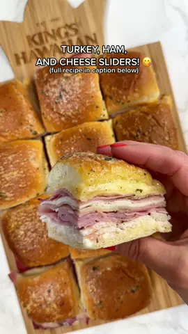 TURKEY, HAM, & CHEESE SLIDERS! 😍   Ingredients: -King’s Hawaiian Original Hawaiian Sweet Rolls -Mayonnaise -Sliced turkey -Sliced honey ham -Sliced provolone cheese -3 tbsp butter (melted) -1 tbsp ranch seasoning   Preparation: 1. Slice King’s Hawaiian Original Hawaiian Sweet Rolls in half (lengthwise), then spread mayonnaise on the bottom rolls 2. Add a layer of sliced turkey, a layer of sliced honey ham, and a layer of provolone cheese, then add another layer of sliced turkey and sliced honey ham 3. Place top rolls back on and brush with ranch butter (3 tablespoons of melted butter with 1 tablespoon of ranch seasoning) 4. Cover sliders with foil and bake at 350 for 10 minutes, then remove foil and bake an additional 5-10 minutes #kingshawaiian 