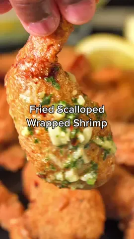 Fried Scalloped Wrapped Shrimp  (Would you try these??) • Ingredients -  365F for 5-7 min  1 Lb Scallops  1 1/2 Lb Shrimp  1/4 Cup Breadcrumbs  2 Eggs  2 Tsp Heavy Cream 1 Tsp Water  1/2 Cup Cornmeal or Fish Fry  1/4 Cup Flour  —————- Garlic Butter Sauce (Melt everything together) 3 Tbsp Butter  2 Cloves Minced Garlic 1 Tbsp Heavy Cream  Parsley and squeeze of Lemon Juice. ———————————————#seafood #friedshrimp #scallops #Foodie #fyp #snack #foodtiktok 