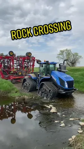 Crossing the Woodriver rock crossing with new Holland T9 700. Pulling a 80 foot Vaderstad air drill #plant23 #workhorse #saskatchewan #canada #farmtok #river #woodriver #vaderstad #seedhawk #nht9700 #newholland #familyland 