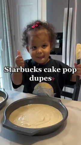She loves helping bake & these turned out so good!! #homemadecakepops #toddlerbaking #sahtoddlermom #sahmtoddlerlife #momandtoddlerbaking #starbuckscakepops #starbucksdupe 