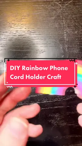 Upcycle a ribbon spool into an easy rainbow phone cord craft. This would be a fun summer kids craft activity.  #rainbow #easycraft #crafty #recycledcrafts #makersoftiktok #diy 