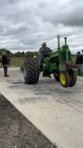 ⚠️Wheelie bars are attached for safety of driver. Do not attempt⚠️ In cement pulling, everyone is given 2 attempts at 30 seconds each to pull the sled for a full pull (10 feet, 120 inches). Rules state ag tires only, so we cannot run slicks, or have the tire hit in between the lugs. Some may wonder about the fromt facing tires, we run these tires forward, because they are already spun in in that direction for cement pulling. Tire direction does not seem to matter as much as most think. Tire compound and contact is what wins. #tractor #tractorpulling #pulling #cementpulling #wheelie #johndeere #spiesspullingteam #antiquetractortok #oldtractor #farmtractor #farmlife 