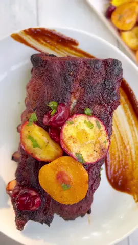 Grilled Baby Back Ribs and Stone Fruit with Smoky Bourbon Barbecue Sauce. Full recipe at thefreshmarket.com #bbqlife #bbq #bbqribs #porkribs #grilllife #grillers #bbqtime #barbecueribs #homemadebbqsauce #recipeoftheday #whatsfordinner #viral #grillrecipes #bbqrecipes #summerrecipes #dinnertime #fyp 