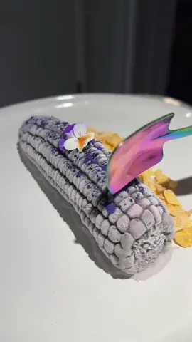 Today I’m gonna show you on today’s episode of me remaking old dishes I have done in the past I show you the corn custard 2.0 💜 🌽 when I tell you that purple corn is hard to work with I’m not kidding 😂 unlike regular corn, purple corn as much starchier and almost chalky. Though the color is really pretty it’s best used when it is dried. I love everything corn so I decided to make it into a purple corn custard!   Are used the purple Peruvian corn for color by soaking it in milk for a day ! To add extra flavor, I soak buttered popcorn and heavy cream for the base of my custard. Popcorn and milk weirdly go well Wally well together 🙈 I decided to be a little bit fancy this time and use fresh vanilla beans  instead of the paste. The color of the milk a mixture was exactly what I was going for but it did turn a little bit gray ones I added the egg yolks. I was too far deep into this to go back and start over so I added the custard into a corn shaped mold then put it in the freezer. The last time I made this frozen corn, I missed an opportunity to make a cool topping for it. So for this time, I blended freeze dried strawberries with blue Spirulina to make a natural purple powder to add on top. I also used purple saw just to make it a little bit more fun.! if you can’t tell purple is my favorite color 😂😂  Finally on the side I added corn flakes and dehydrated corn silks (trust me they are really yummy) though this did not turn out 100% the way I had in mind I still love it a lot more than the first version I did! This one gave me major cottagecore vibes 🙊 But you know what they say third time is the charm 😂 #itscorn #purplecorn #TikTokTaughtMe 