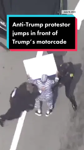 Anti-Trump protestor outside of the federal courthouse in Miami approach the Trump motorcade and get within feet of the vehicles following his arraignment.