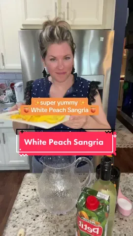White Peach Sangria 1 bottle white wine such as Pinot Grigio, Sauvignon Blanc, Chardonnay  1/2 cup peach schnapps  1/2 cup peach nectar 1/4 cup sugar Fresh peaches, cut into slices Blueberries for garnish (optional) Add all ingredients to a pitcher and stir. Refridgerate 2 hours or overnight Add ice to glasses and pour the sangria over.  *add frozen peach slices to keep it cold if desired  #sangria #peachsangria #whitesangria #summercocktails #summerdrinks