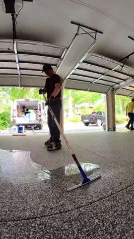 Do you know the real reason we use a polyaspartic top coat?… and no it’s not because it’s 4x stronger than epoxy. 🤪 When we first started installing garage floor coatings about 15 years ago, we would use an epoxy primer with a clear epoxy grout coat. Then we would come back on a *third* trip to apply a urethane top coat.  Epoxy turns an amber color when it’s exposed to UV… So we would use a urethane top coat to try to protect the epoxy.  The problem is that the urethane didn’t really do a very good job at stopping the epoxy from turning amber.  We were excited when polyaspartic top coats became the standard in the industry. They are thick enough to eliminate using epoxy as a grout coat and they are UV stable eliminating a third trip to apply a urethane top coat.  Our online Epoxy/polyaspartic course is now available. Link in bio to learn more. 👍🏻👍🏻 #epoxy #garage #garagefloor #satisfying