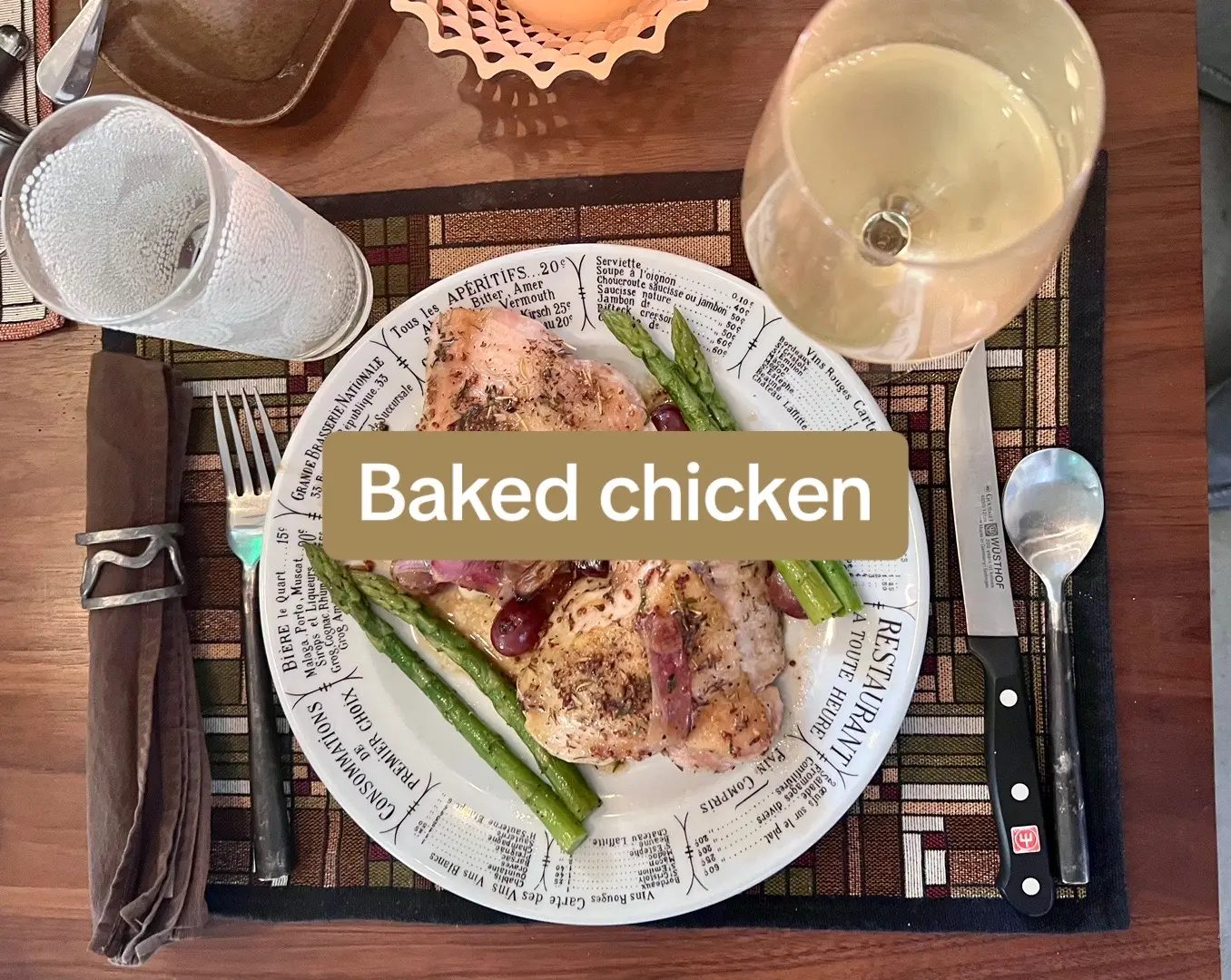 Dinner. Roasted tarragon chicken thighs, with grapes, and red onions. Braised asparagus. Warmed baguette, with butter.  Wine: Vermentino.  Sparkling water, 2 ways, ala @HolgerAlex #dinner #flavelljames  Music: Samara Joy.  Greg Miura Memorial Candle Dipper.