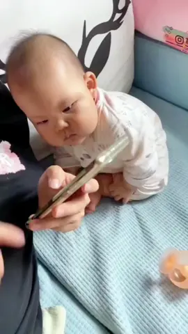 Baby peeking at mobile phone😂#baby #cute #babylove #pyf #cutebaby #funny #adorablebaby #babycute #babylover #babytiktok 